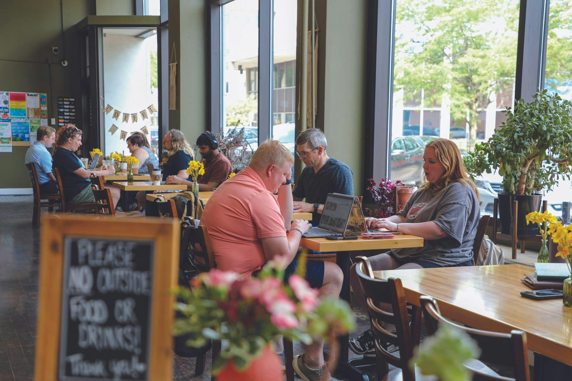 Patrons of the Caffeinery sit inside the shop July 30. Owners Frank and Laura Reber estimate that 15 to 20 percent of their clients are Ball State students and faculty. Trinity Rea, DN. 