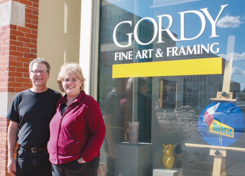 Carl and Barbara Schafer pose outside of Gordy Fine Art and Framing located at 224 E. Main Street, Sept. 9, 2021. Since purchasing Gordy in 2015, the Schafers have grown their reputation as a high-quality frame creation, reproduction and restoration shop. Samantha Lyon, DN