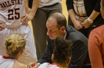 DN PHOTO COREY OHLENKAMP Coach Brady Sallee talks with his players during a timeout in an exhibition game against Oakland City on Wednesday. Sallee took over the position in May after former coach Kelly Packard resigned. 