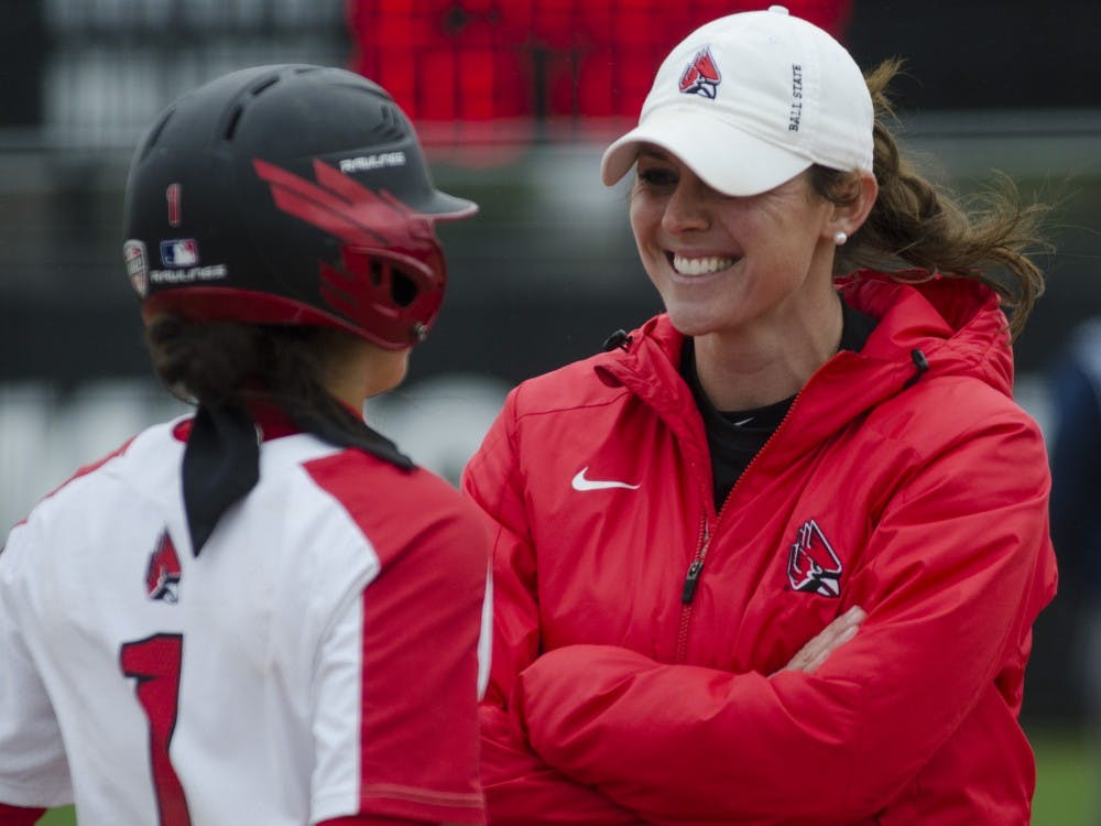 Head coach Megan Ciolli Bartlett talks with junior second baseman Maddy Labrador before her turn at bat during the second game of the double-header against Northern Illinois on April 4 at the Softball Field at the First Merchants Ballpark Complex. Ball State won  6-4. Emma Rogers // DN