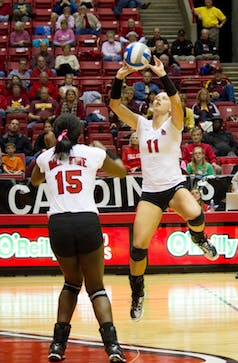 DN FILE PHOTO EMMA FLYNN Junior Jacqui Seidel sets the ball for senior Lisa Scott during the game against Central Michigan on Oct. 5. The Cardinals will take on Western Michigan on Friday and Northern Illinois on Sunday. 