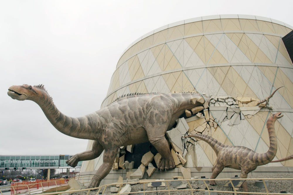 A dinosaur bursts through the front wall of the Children's Museum of Indianapolis, Indiana. (Tom Uhlenbrock/St. Louis Post-Dispatch/MCT)
