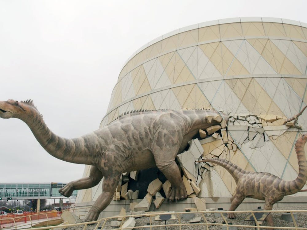 A dinosaur bursts through the front wall of the Children's Museum of Indianapolis, Indiana. (Tom Uhlenbrock/St. Louis Post-Dispatch/MCT)