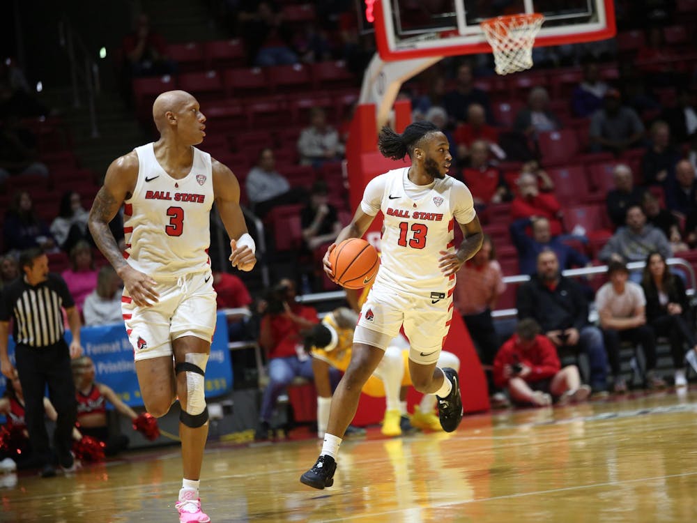 Junior forward Mickey Pearson Jr.  and freshman guard Trent Middleton Jr. run up court against Kent State University Mar. 5 at Worthen Arena. Liz Peterson, DN. 