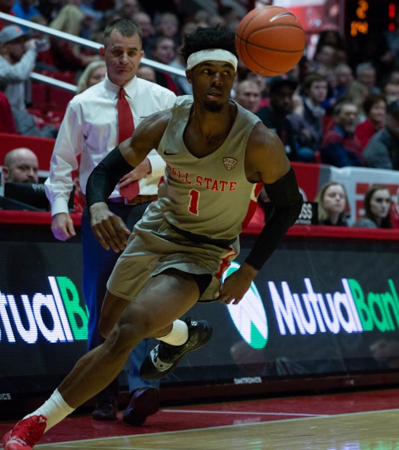 Redshirt junior guard K.J. Walton rushes towards the ball during the game against the University of Akron in John E. Worthen Feb. 16, 2019. The Zips fell to the Cardinals 57-56. Scott Fleener, DN