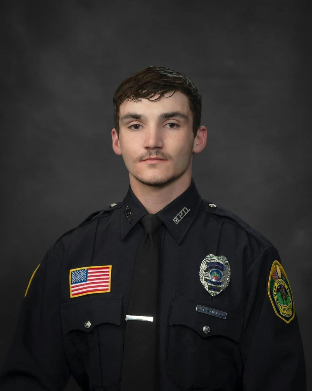 Muncie Police Officer Josiah Mauller posing for a work-based portrait. Photo courtesy of City of Muncie