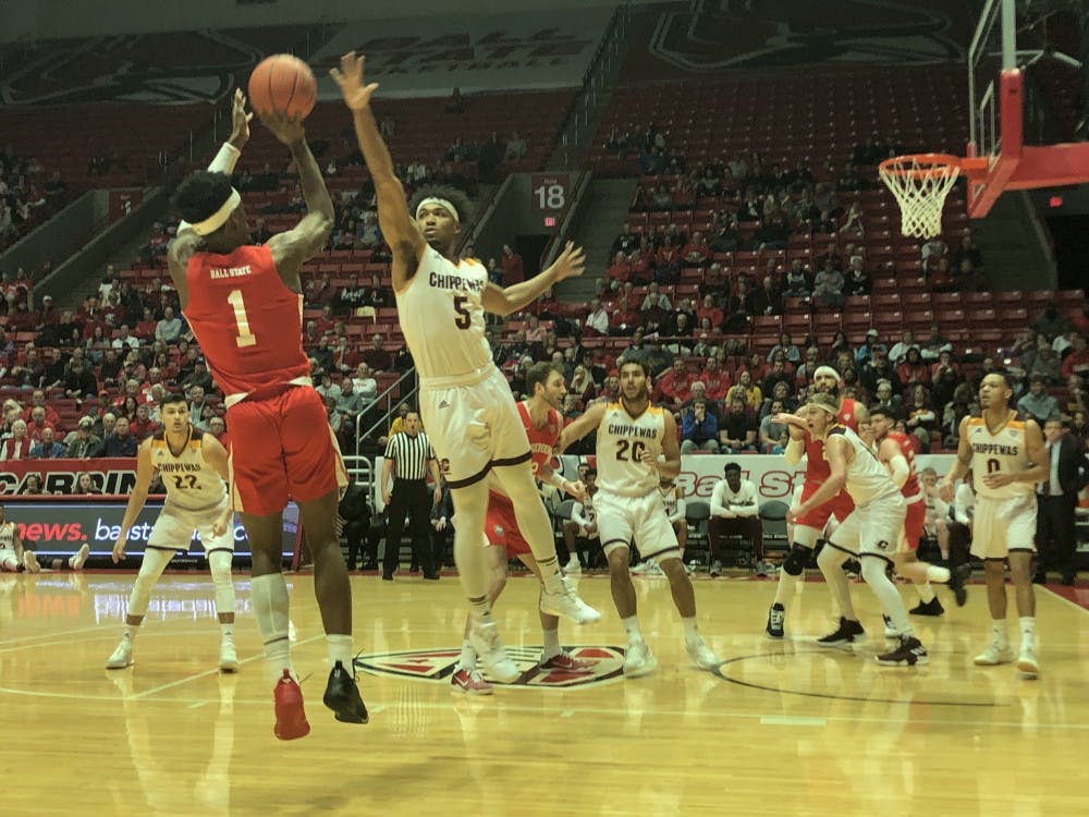 Redshirt junior guard K.J. Walton shoots over a Central Michigan defender in a game against the Chippewas on Feb. 23 at Worthen Arena. The Cardinals fell to the Chippewas, 64-57. Jack Williams, DN&nbsp;
