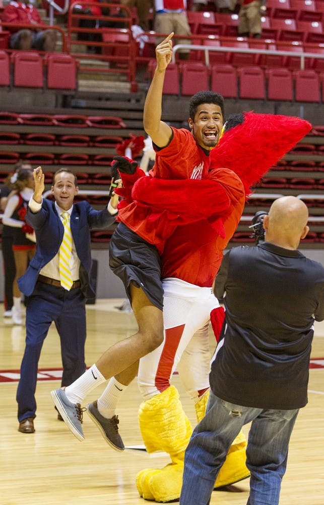 Lemuel Turner hugs Charlie Cardinal after making the half-court shot for free tuition on Aug. 20 in Worthen Arena. Turner played varsity basketball the last four years in high school. PHOTO PROVIDED BY BALL STATE UNIVERSITY