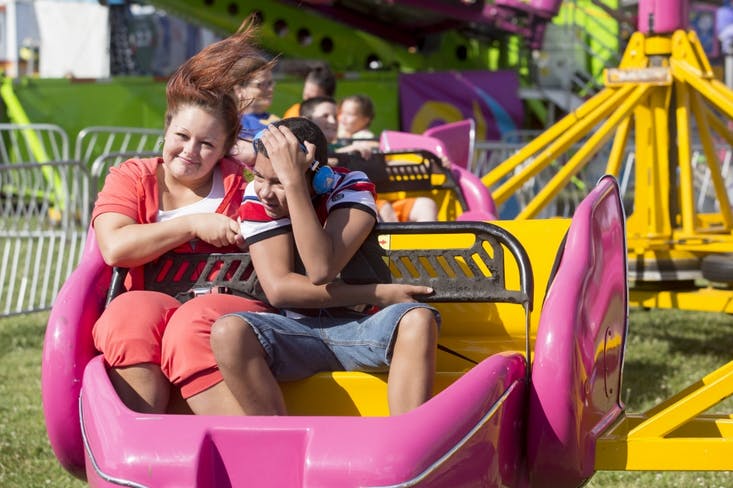 Fairgoers go on rides July 15 at the Delaware County Fair. DN PHOTO JORDAN HUFFER