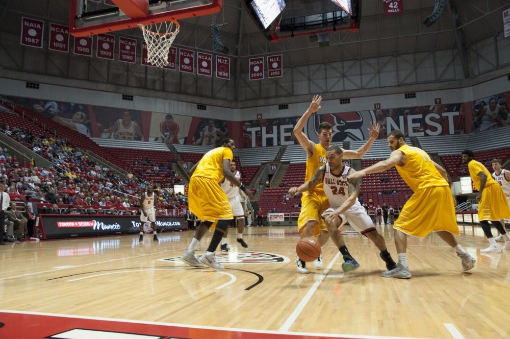 Ball state's  senior Jeremiah Davis slips past Valparaiso's defense  during the game against Valparaiso on Nov. 28 at Worthen Arena. DN PHOTO AMER KHUBRANI