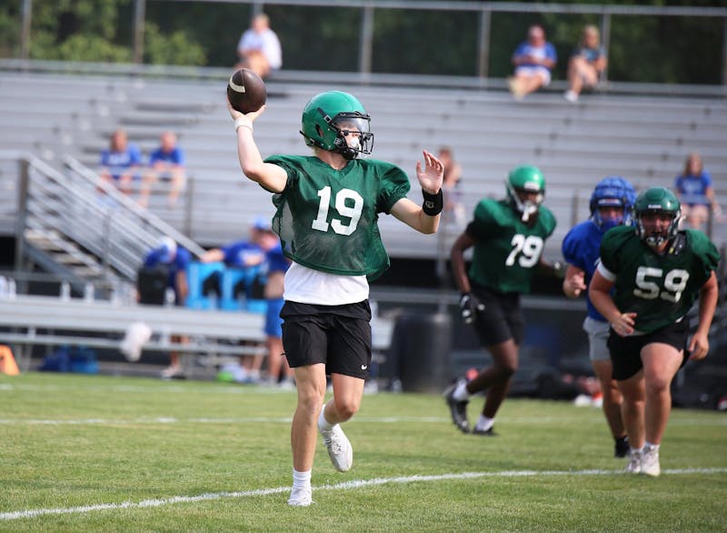 Yorktown sophomore quarterback Sam Tokar looks to throw  July 24 during a practice at Yorktown High School. Yorktown went 5-6 in 2023. Zach Carter, DN.