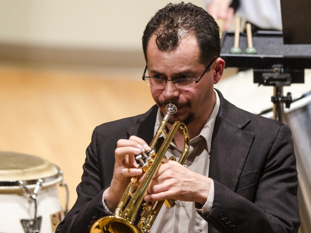 Gilmar Cavalcante plays the trumpet on May 1 with the Brazilian Ensemble at John J. Pruis Hall. The coordinator of the Ensemble was Bruno Carera, who arranged the music. Stephanie Amador // DN