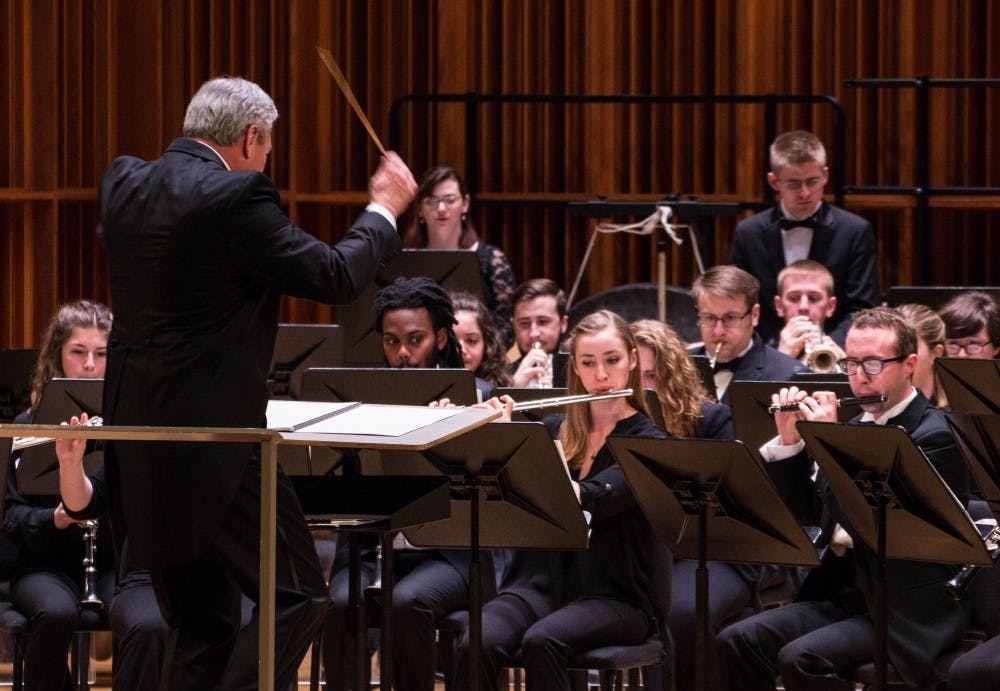 Thomas Caneva conducts the Ball State Wind Ensemble as they play Dooley's Mavericks, Maslanka's Concerto No. 3 and Holst's First Suite in E-Flat during the first half of the School of Music's Masterworks Concert in Sursa Performance Hall on Feb. 24. The selections of music will be performed at this year’s College Band Director’s National Association (CBDNA) National Conference. Grace Ramey, DN File