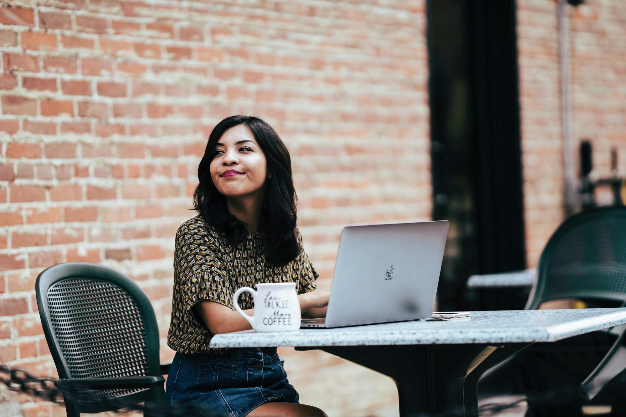 Erika Espinoza, Ball State graduate, looks to the side while working at her laptop. Espinoza is a journalism graduate and worked with Stephen Beard on “The Wall.” Erika Espinoza, Photo Provided