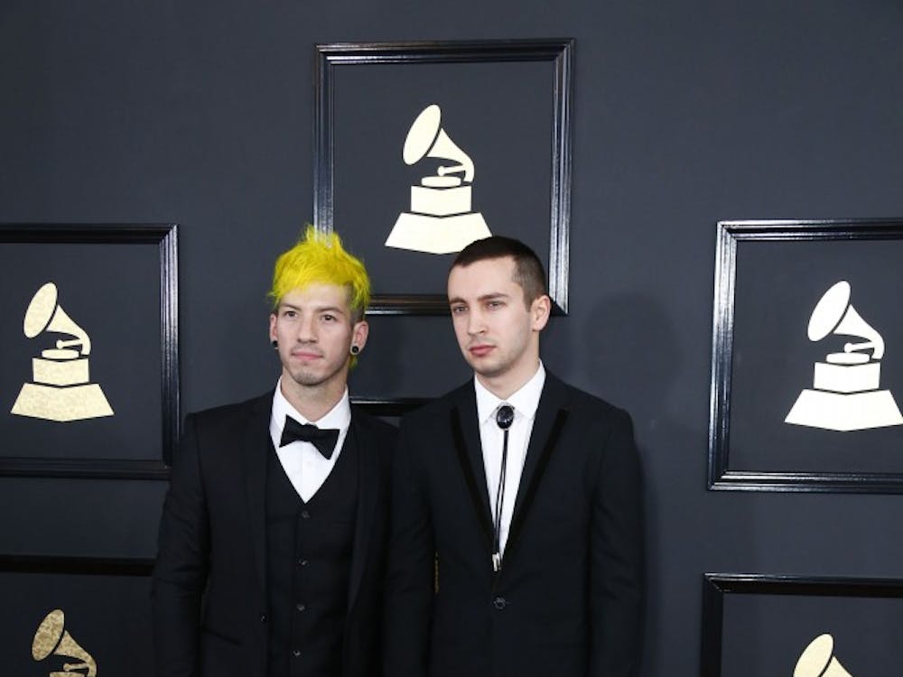 Josh Dunn, left, and Tyler Joseph of Twenty One Pilots arrive at the 59th Annual Grammy Awards at Staples Center on Feb. 12.  A Grammy was awarded to 21 Pilots for their song “Stressed Out”. TNS Photo