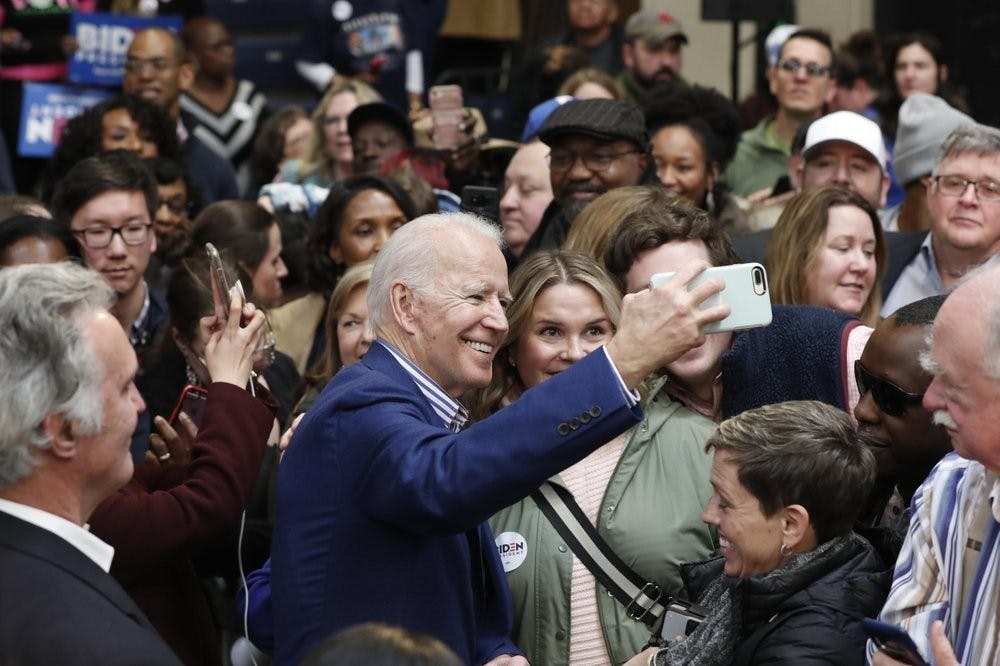 <p>Democratic presidential candidate former Vice President Joe Biden takes photos with supporters at a campaign event at Saint Augustine's University in Raleigh, N.C., Saturday, Feb. 29, 2020. <strong>(AP Photo/Gerry Broome)</strong></p>