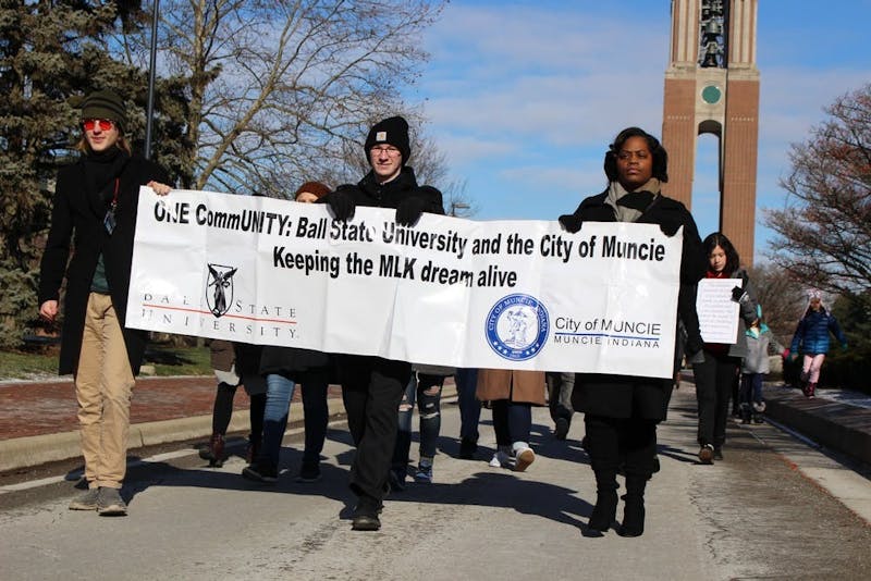 Participants march Jan. 20, 2020, for Ball State's MLK Unity March down McKinley Avenue. The march and the breakfast which preceded it mark the start of Ball State's Unity Week events. Bailey Cline, DN