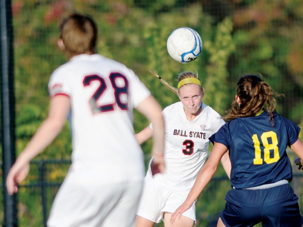 Freshmen defender Leah Mattingly heads a ball during the game against Kent State University on Oct. 4. The end of the regular season brings the Cardinals into MAC tournament time, where the team will look for its first tournament victory since 2007. DN FILE PHOTO COREY OHLENKAMP