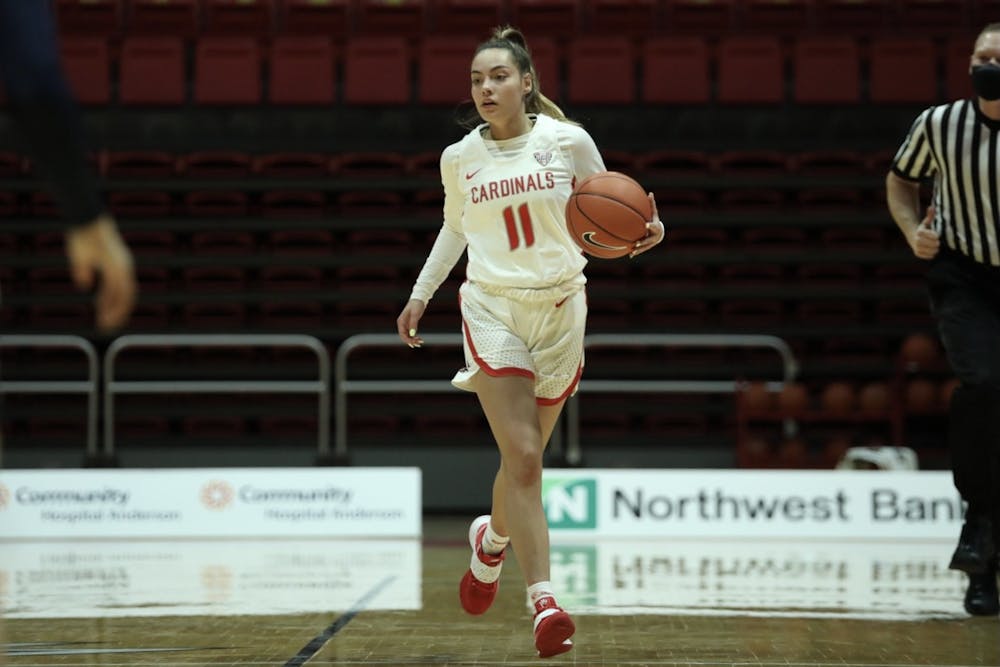 Cardinals sophomore guard Sydney Freeman dribbles the ball down the court Feb. 6, 2021, at John E. Worthen Arena. The Cardinals lost 89-84 to the Zips. Jacob Musselman, DN 