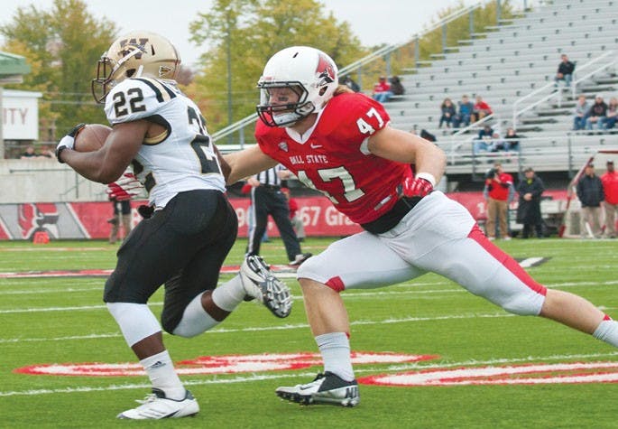 DN FILE PHOTO JONATHAN MIKSANEK Tony Martin goes after a Western Michigan runner during the first half of the game on Saturday Oct. 13, 2012. Martin is a senior for Ball State and will be playing his last home game today.