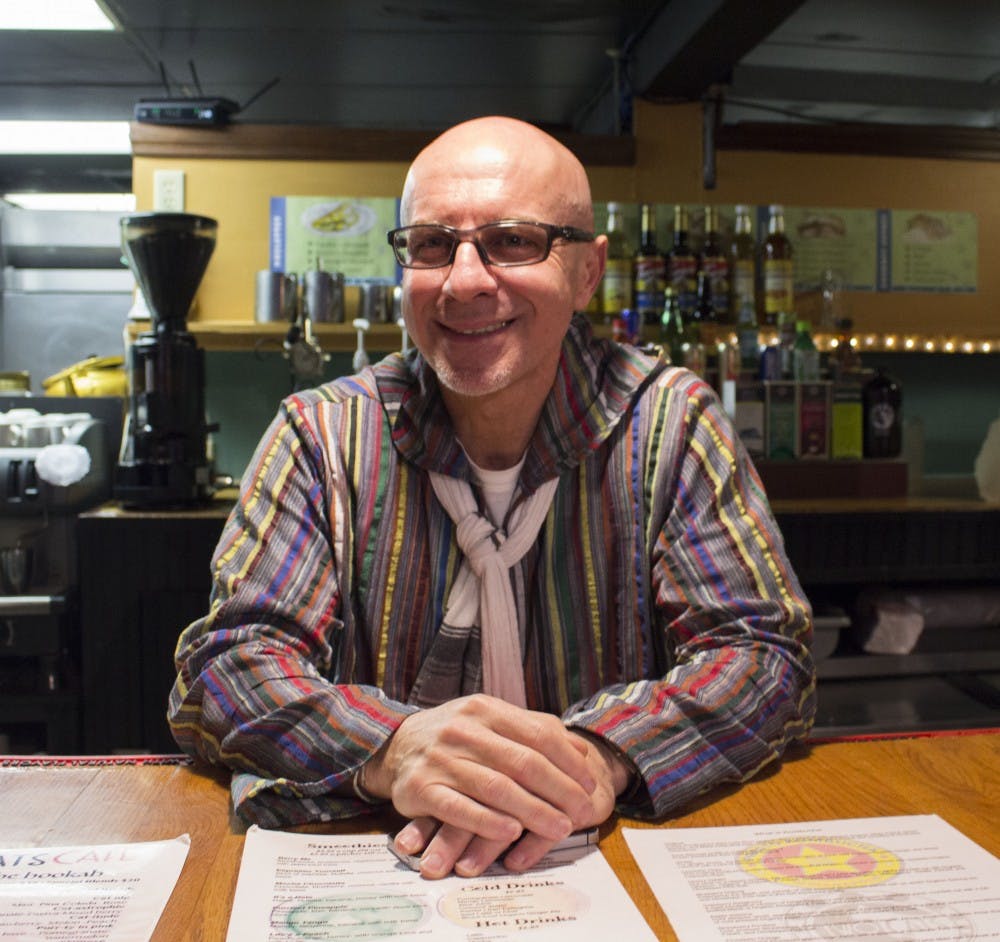 <p>Basam Helwani stands behind the counter of Two Cats on Jan. 26. &nbsp;Two Cats was opened up in the Village a year ago and is the second restaurant that Helwani has opened. &nbsp;Michelle Kaufman // DN</p>