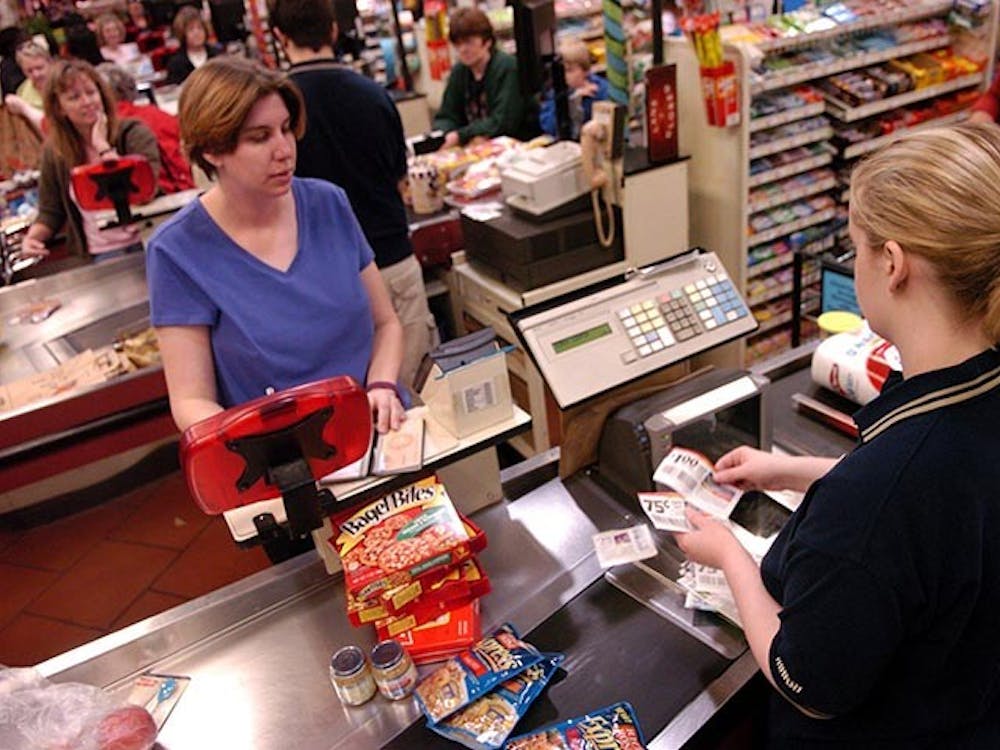 When at the checkout counter, watch the display screen for each item and its corresponding price. If you think you're being overcharged, speak up. Here, cashier Erin Travis scans coupons from Heather Sokol at a Marsh Supermarket in Westfield, Indiana. (Antonio Perez/Chicago Tribune/MCT)