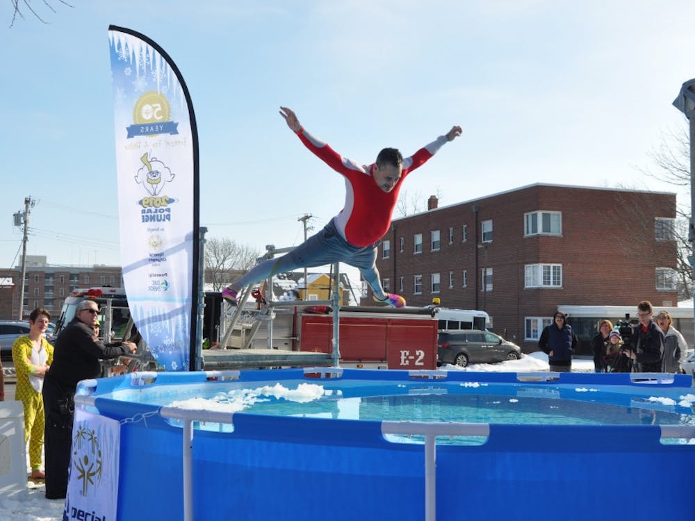 A volunteer belly flops into a pool of cold water at the annual Special Olympics Indiana Polar Plunge Saturday, Feb. 2, 2019, at the L.A. Pittenger Student Center. This year's plunge raised an estimated $20,000, more than any other previous plunge at Ball State. Jacob Musselman, DN