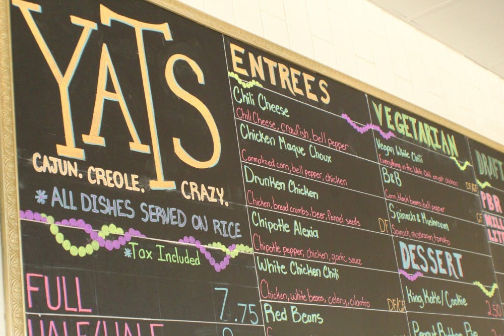 The Yats menu chalkboard displays available food items at the downtown Muncie location. Dan Tosson, who previously managed stores in Cincinnati and Noblesville, Indiana, currently manages the Village location. Amelia Cisna, DN
