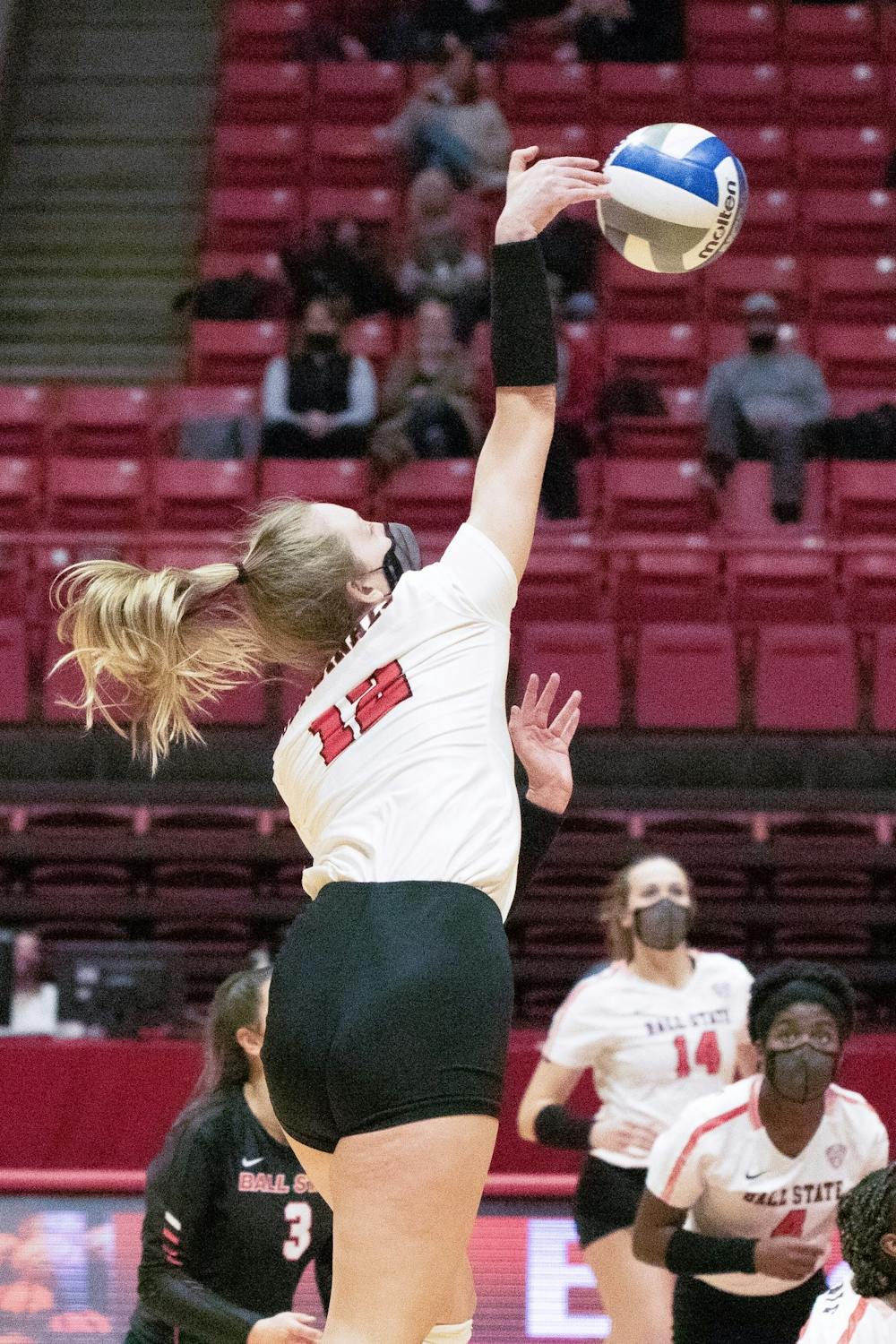 Freshman outside hitter Cait Snyder kills the ball Feb. 12, 2021, in John E. Worthen Arena. The Cardinals lost to the Falcons 0-3. Madelyn Guinn, DN