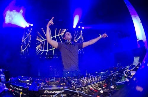 DJ Max Troyak mixes his set from a large stage set up in Worthen Arena. Troyak had a handful of friends who followed him to Muncie, eventually becoming part of the Life in Color show Nov. 10. DN FILE PHOTO COREY OHLENKAMP