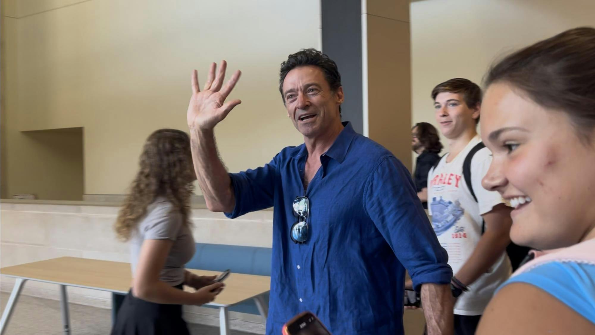 Hugh Jackman waving to students on Ball State campus.