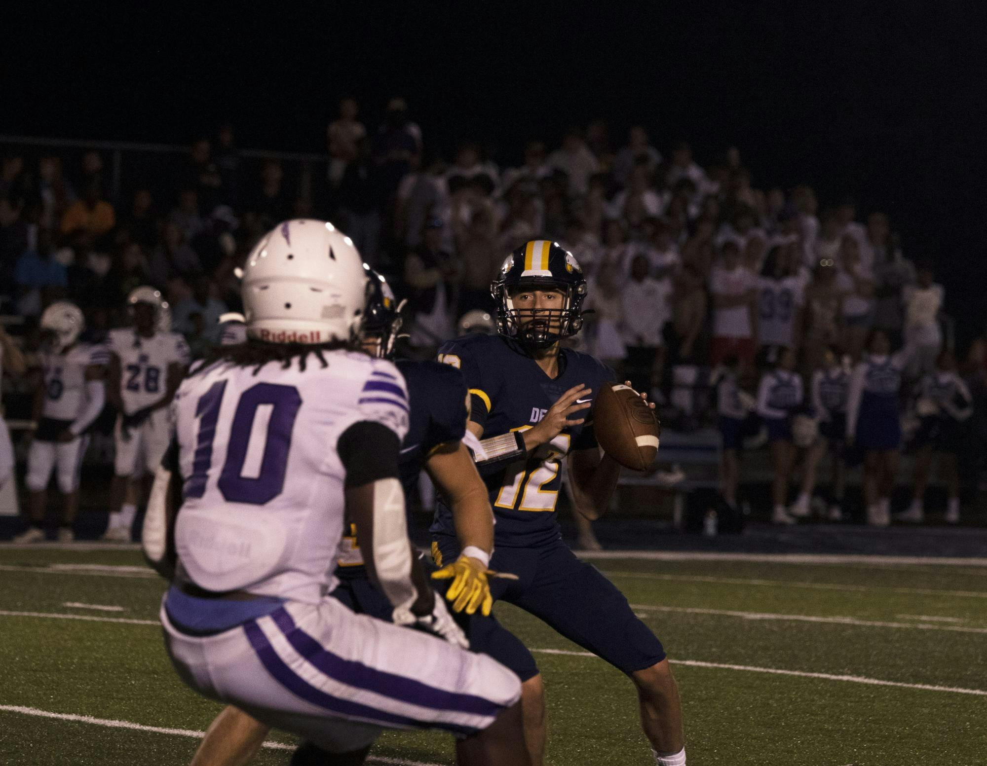 Delta junior quaterback Bronson Edwards prepares to throw August 18 duirng week one against Muncie Central. Zach Carter, DN.