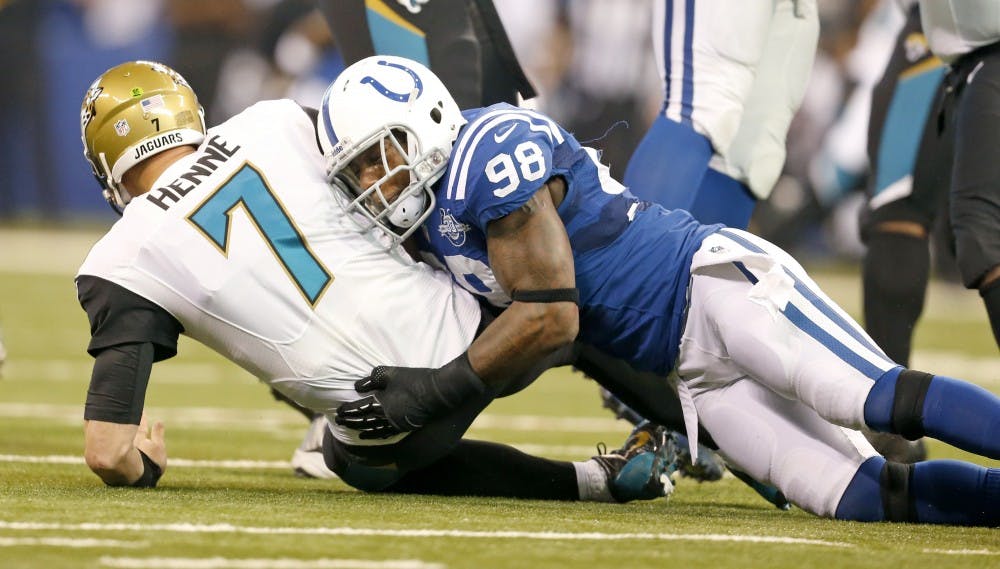 Indianapolis Colts outside linebacker Robert Mathis sacks Jacksonville Jaguars quarterback Chad Henne in the game on Dec. 29, 2013, in Indianapolis. Mathis is out for the season after tearing an Achilles tendon. MCT PHOTO