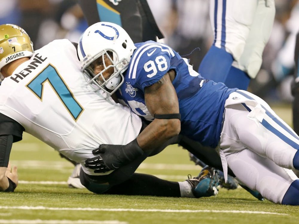 Indianapolis Colts outside linebacker Robert Mathis sacks Jacksonville Jaguars quarterback Chad Henne in the game on Dec. 29, 2013, in Indianapolis. Mathis is out for the season after tearing an Achilles tendon. MCT PHOTO