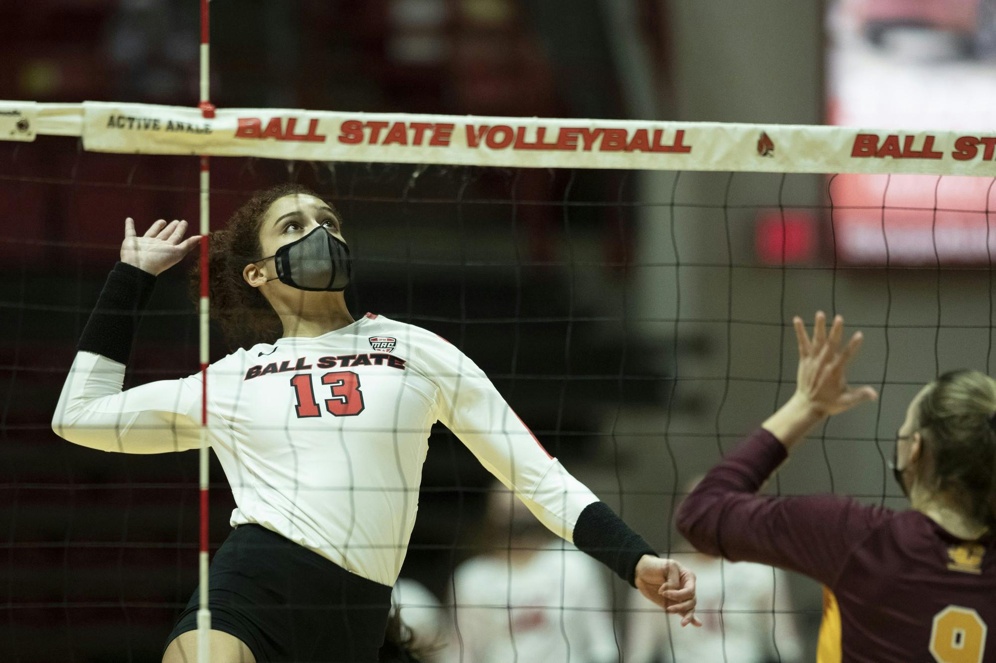 Cardinals sophomore outside hitter Natalie Mitchem goes up for a spike against Central Michigan University March 19, 2021, at John E. Worthen Arena. The Cardinals beat the Chippewas 3-2. Jacob Musselman, DN
