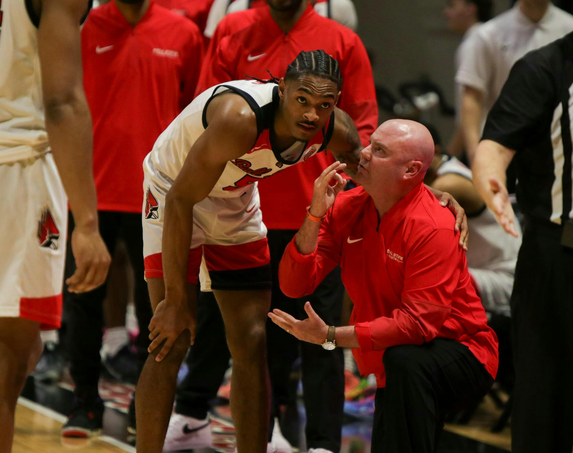 Ball State junior guard Armoni Zeigler listens to Head Coach Micheal Lewis during a play review Feb. 24 at Worthen Arena. Zeigler has a season high of 11 goals in a single game. Adam Jones, DN