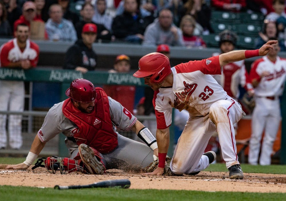 Junior right fielder Ross Messina slides into home during the third inning of the game against Indiana April 23, 2019, at Victory Field in Indianapolis. Messina was the only Cardinal to have multiple hits in the game. Rebecca Slezak, DN