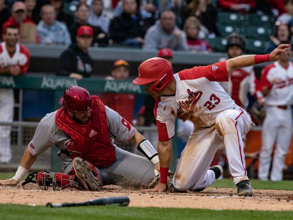 Junior right fielder Ross Messina slides into home during the third inning of the game against Indiana April 23, 2019, at Victory Field in Indianapolis. Messina was the only Cardinal to have multiple hits in the game. Rebecca Slezak, DN