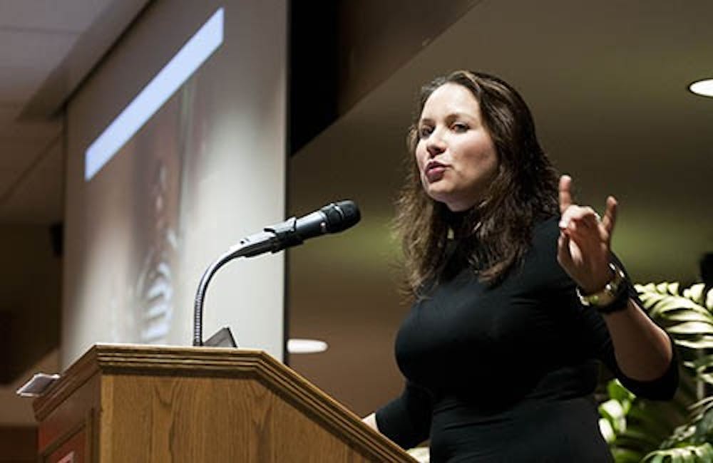 Associated Press West African Bureau Chief Rukmini Callamachi speaks about her experience writing a story about child brides in Niger during her Professional in Residence speech on Wednesday. Callamichi was awarded the Pulliam Award for the story. DN PHOTO BOBBY ELLIS