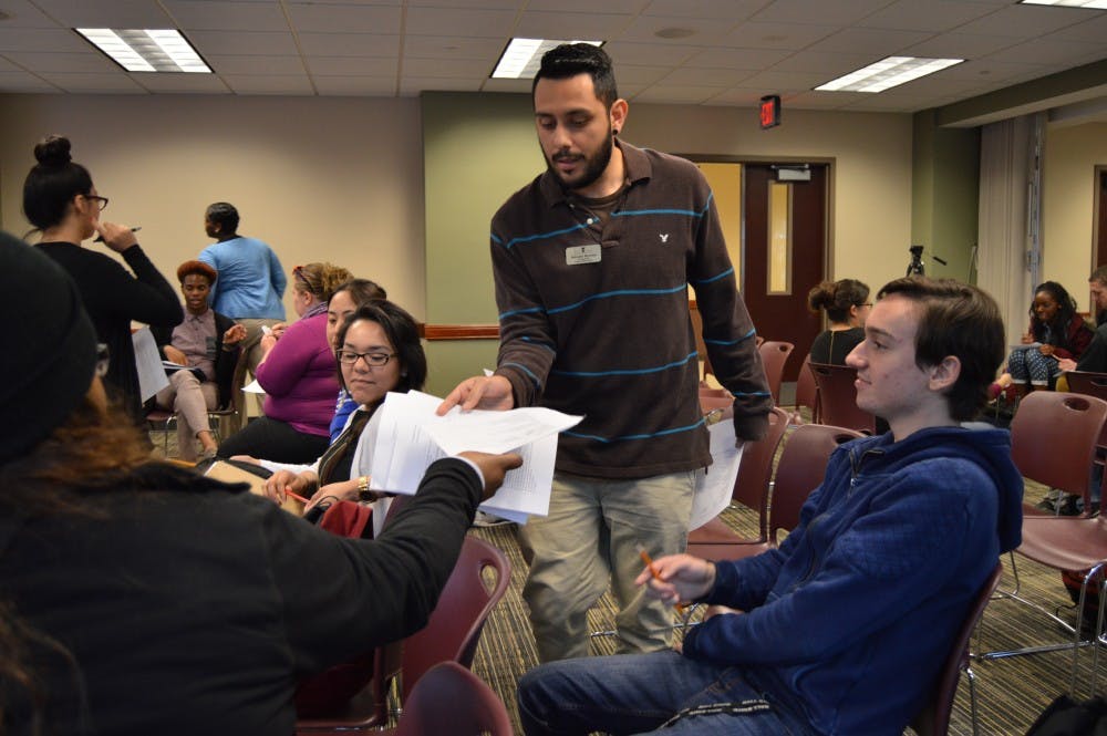 <p>The Latino Student Union&nbsp;hosted a Citizen Workshop on March 23 in the L.A. Pittenger Student Center to discuss the process of applying for citizenship. One of the activities included taking the test, Form N-400, to become a citizen. The test were later graded to see if the students would have passes. <em>DN PHOTO ALLIE KIRKMAN</em></p>