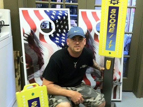 Paul Dytmire, a Muncie native, invited a corn hole score keeping device that took a prestigious award at a trade show. The Awkward will help him sell his invention to an investor. PHOTO PROVIDED BY Paul Dytmire