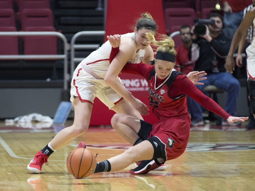 <p>Senior forward Moriah Monaco, left, and Northern Illinois’ Kelly Smith, right, go after a loose ball during the Cardinals’ game against the Huskies Jan. 27 in John E. Worthen Arena. Ball State won 81-72.<strong> Eric Pritchett, DN</strong></p>