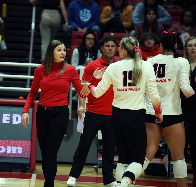Women's volleyball coach Kelli Miller Phillips gives junior setter Megan Wielonski a high-five during a time out agianst Toledo Oct. 17 at Worthen Arena. Ball State won 3-0 against Toledo. Mya Cataline, DN