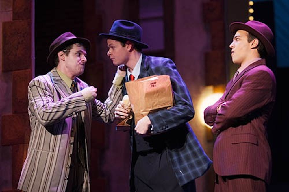 Nathan Detroit, played by Brad Root, discusses with Nicely Nicely, played by Justin Habben, plans for their upcoming craps game. Guys and Dolls opens today in University Theatre. DN PHOTO JONATHAN MIKSANEK