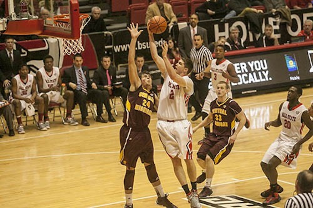 Matt Kamieniecki shoots the ball during the game against Central Michigan on Feb. 27. Kamieniecki was brought in to give the Cardinals a  defensive boost in the paint. DN FILE PHOTO JORDAN HUFFER