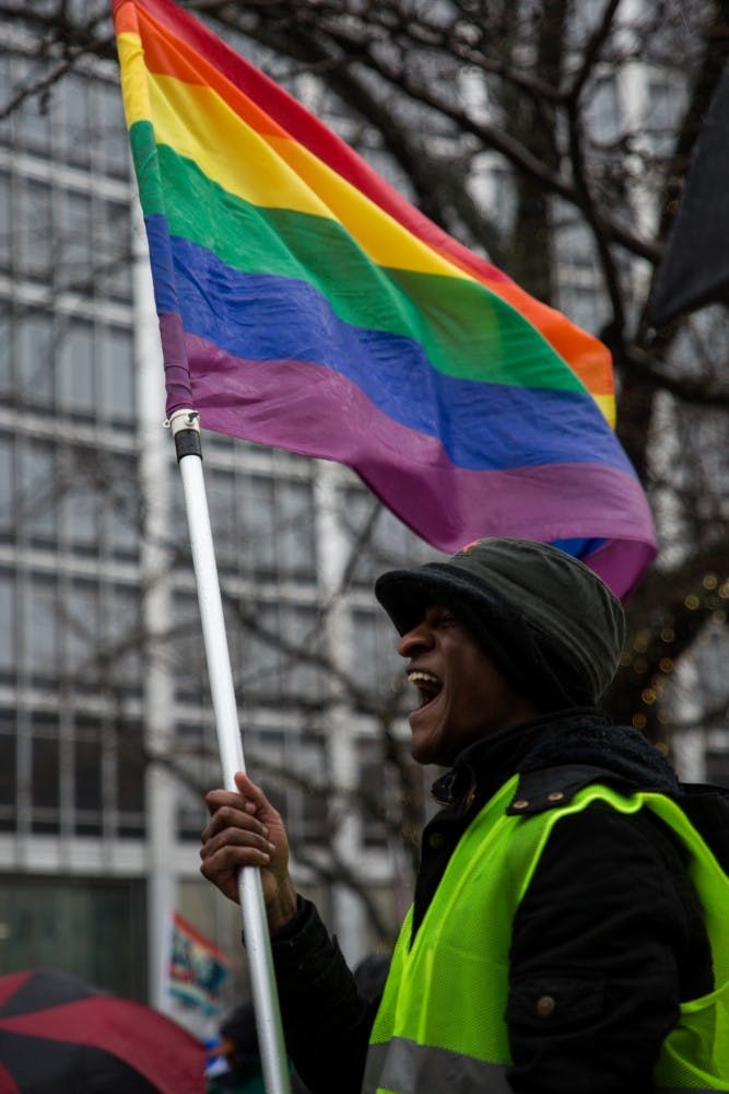 &nbsp;Andrew Brown stands at Monument Circle in Indianapolis Jan. 19, where participants in Indiana’s Women’s March gathered before heading to the American Legion Mall for the rally. Student Government Association passed a resolution that would create a LGBTQ liaison position for students. Eric Pritchett, DN&nbsp;