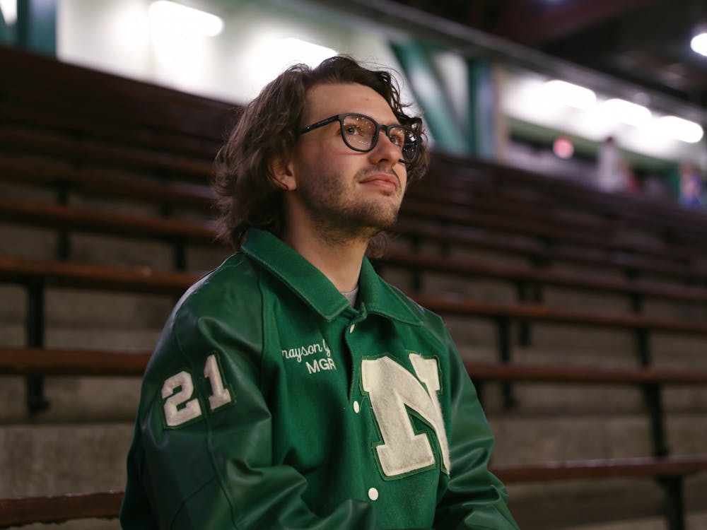 Second-year opinion editor Grayson Joslin sits in the stands at New Castle Fieldhouse March 3 in New Castle, Ind. Amber Pietz, DN