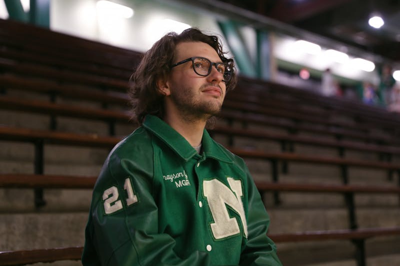 Second-year opinion editor Grayson Joslin sits in the stands at New Castle Fieldhouse March 3 in New Castle, Ind. Amber Pietz, DN