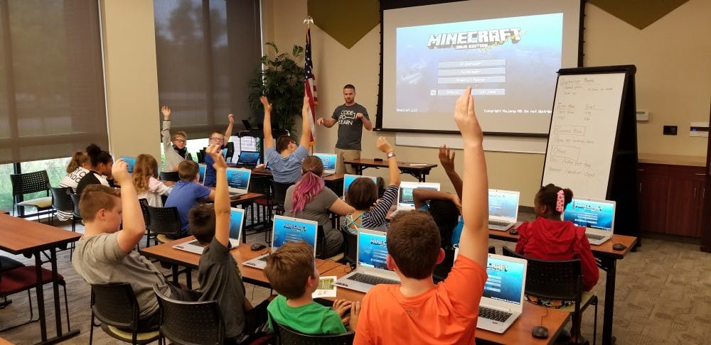 Ryan Hunter, co-founder of TechWise Academy, leads a Minecraft Party in which students get to learn about command blocks and play online in a safe environment. TechWise began regular coding classes for K-12 students in August. Brandon Coppernoll, Photo Provided