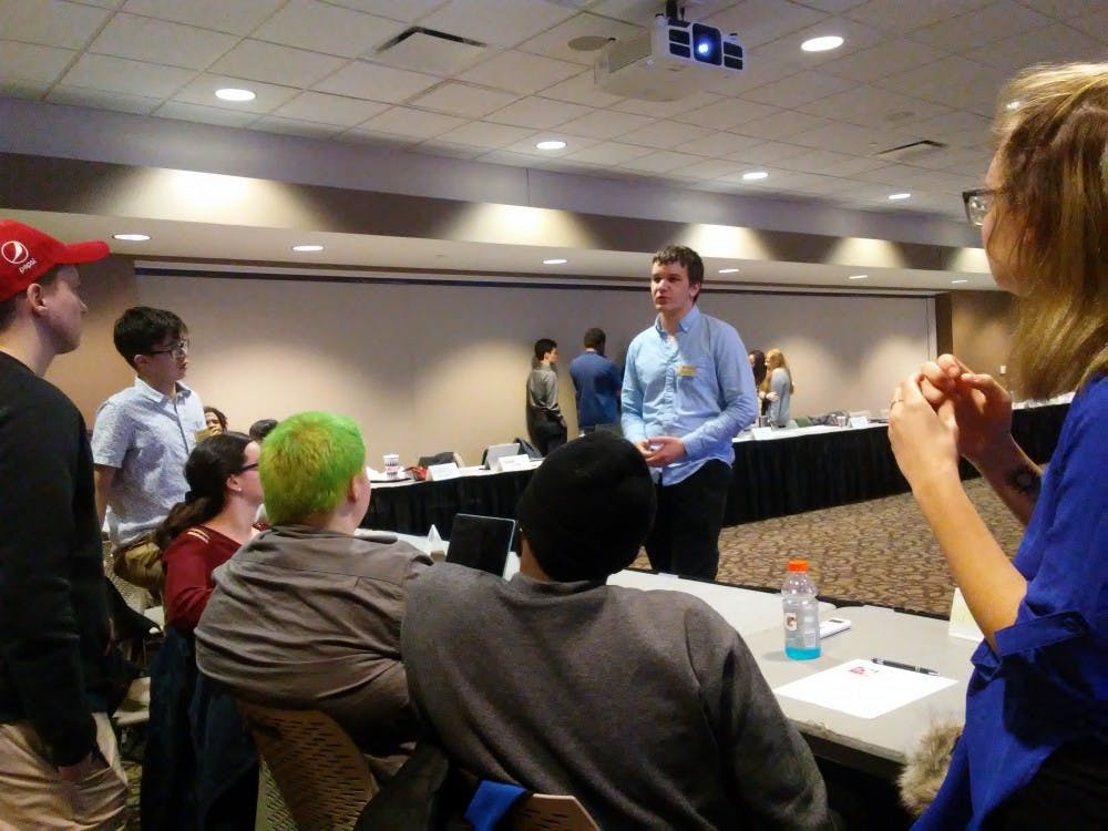 Ball State Student Government Association (SGA) voted against a resolution to lower the minimum GPA requirements for senators, Tuesday. The resolution lost the vote 16-21. Charles Melton, DN